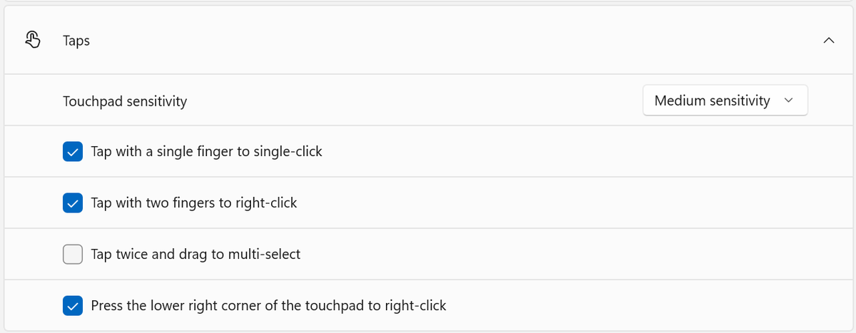 Windows 11 Touchpad settings showing the Taps section with the option to press the lower right corner of the touchpad to right-click
